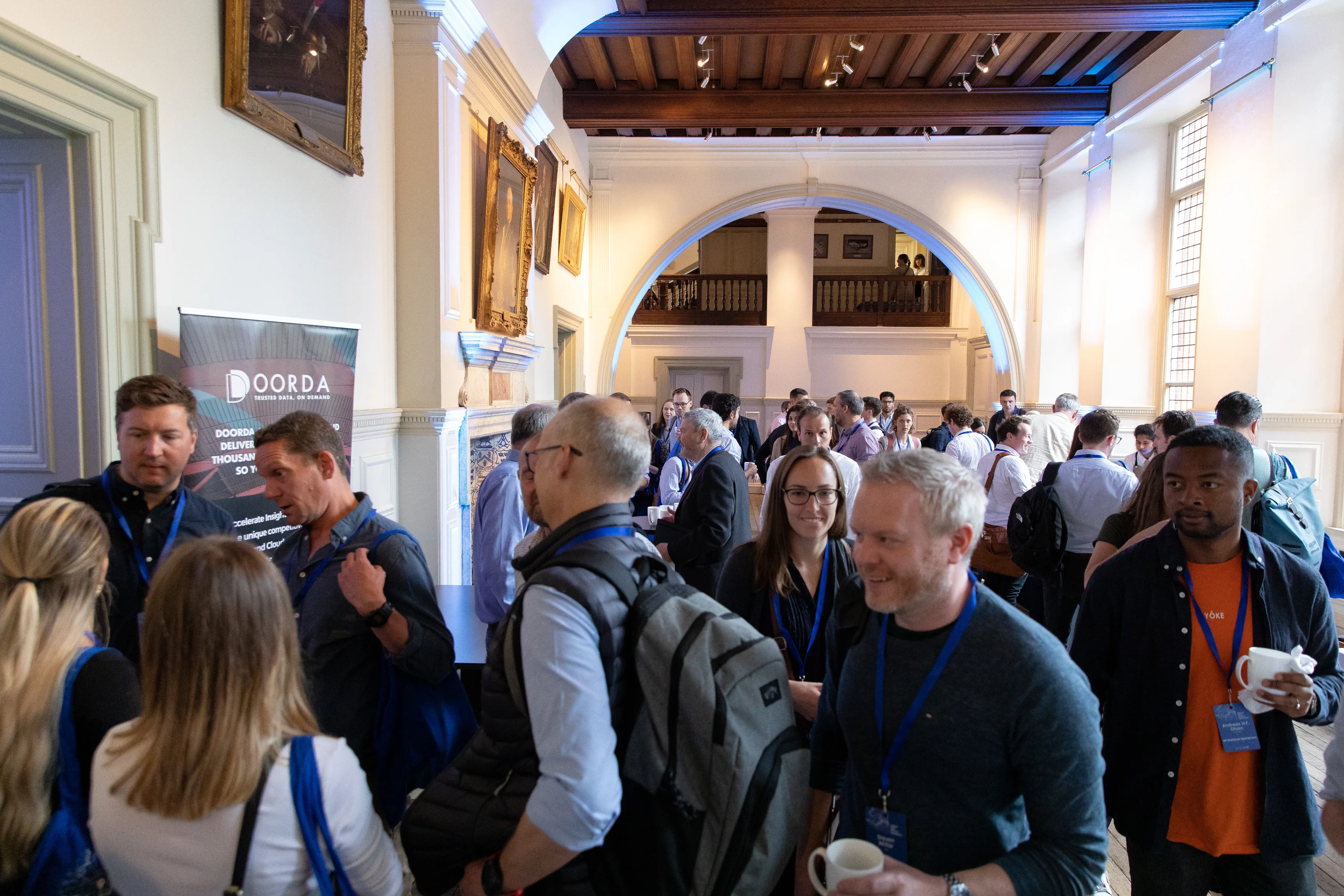 People enjoying the networking break at the Royal Geographical Society.