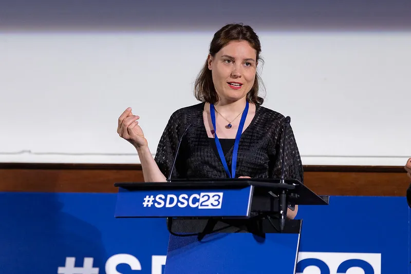 Data scientist from Connected Kerb speaking to the audience at the conference.